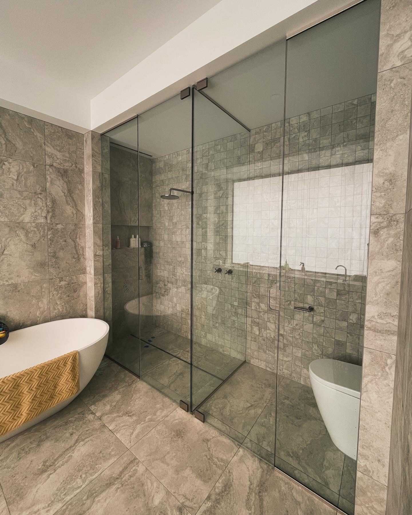 Frameless shower screen in marble ensuite, Adelaide